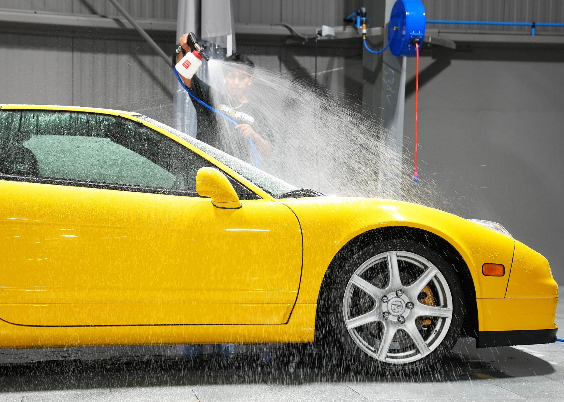 Water sheeting off an Acura NSX at A Buff & Beyond