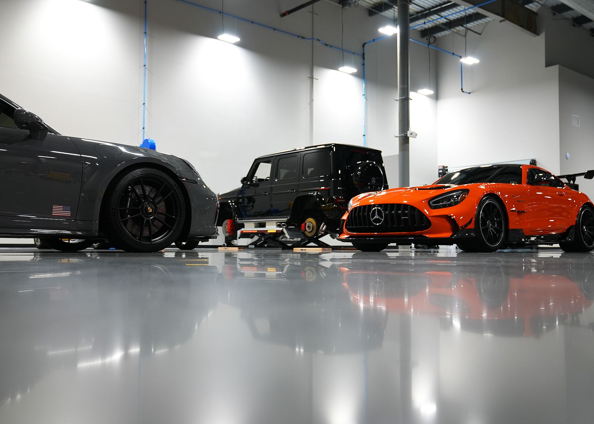 Performance cars in the A Buff & Beyond Ocean studio for PPF